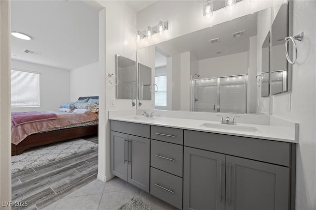 605 Cadence Vista Dr, Henderson, NV 89011 - ensuite bathroom featuring double vanity and a shower with shower door