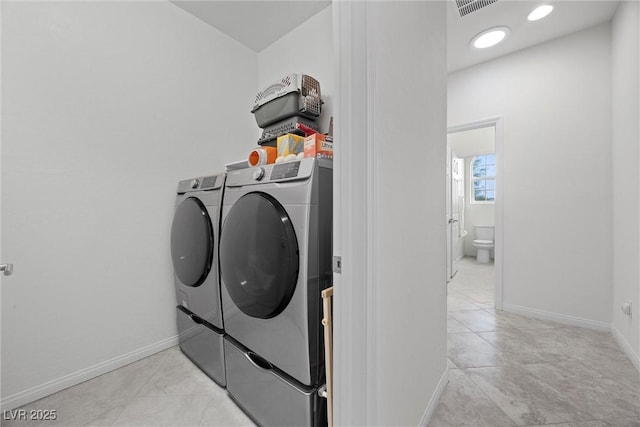 605 Cadence Vista Dr, Henderson, NV 89011 - laundry room with washer and clothes dryer and light tile patterned flooring