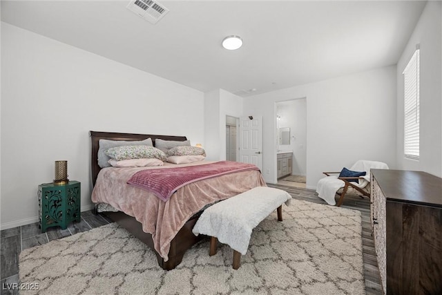 605 Cadence Vista Dr, Henderson, NV 89011 - bedroom featuring wood finished floors and ensuite bathroom