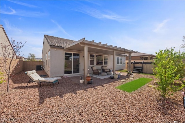 605 Cadence Vista Dr, Henderson, NV 89011 - rear view of house featuring a patio area, a fenced backyard, stucco siding, and a tiled roof