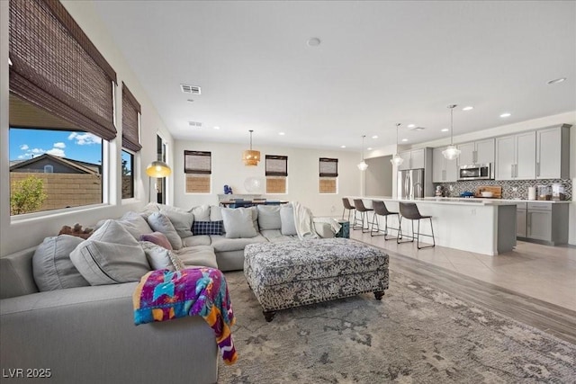 605 Cadence Vista Dr, Henderson, NV 89011 - living room with healthy amount of natural light, light wood-style flooring, and recessed lighting