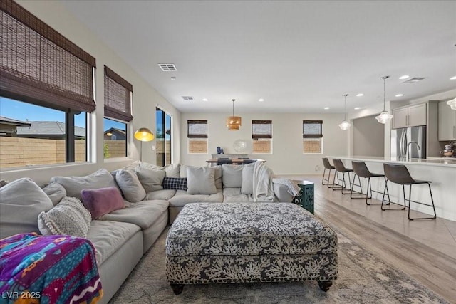 605 Cadence Vista Dr, Henderson, NV 89011 - living area with recessed lighting and light wood-style floors