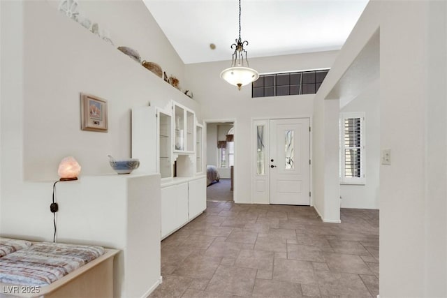 2216 Sapphire Valley St, Las Vegas, NV 89128 - foyer entrance featuring stone tile flooring and high vaulted ceiling