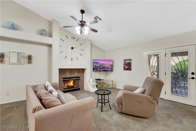 2216 Sapphire Valley St, Las Vegas, NV 89128 - living room with carpet flooring, lofted ceiling, ceiling fan, and a tile fireplace
