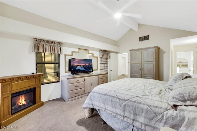 2216 Sapphire Valley St, Las Vegas, NV 89128 - bedroom featuring light colored carpet, a glass covered fireplace, and ceiling fan