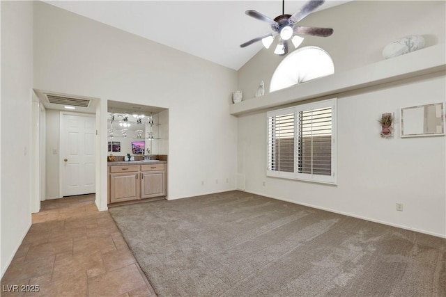 2216 Sapphire Valley St, Las Vegas, NV 89128 - unfurnished living room with high vaulted ceiling, a ceiling fan, and carpet flooring