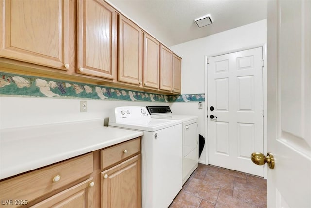 2216 Sapphire Valley St, Las Vegas, NV 89128 - laundry room with cabinet space, independent washer and dryer, and light stone finish floors