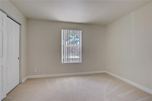 2801 N Rainbow Blvd Unit 273, Las Vegas, NV 89108 - unfurnished bedroom featuring light carpet and baseboards