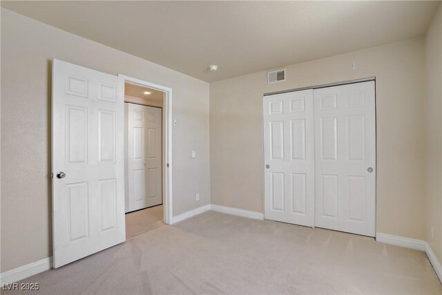 2801 N Rainbow Blvd Unit 273, Las Vegas, NV 89108 - unfurnished bedroom featuring light carpet and a closet