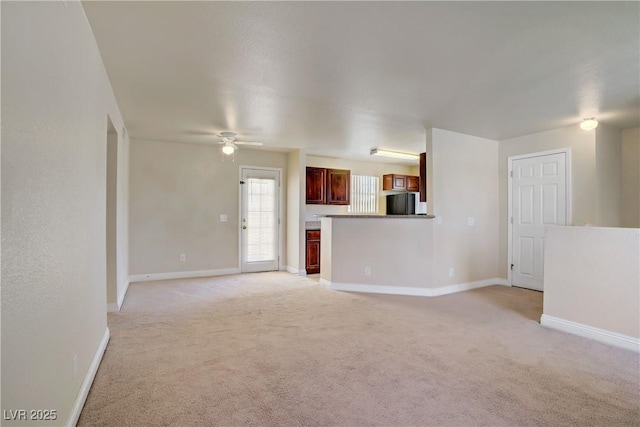 2801 N Rainbow Blvd Unit 273, Las Vegas, NV 89108 - unfurnished living room with light colored carpet and a ceiling fan