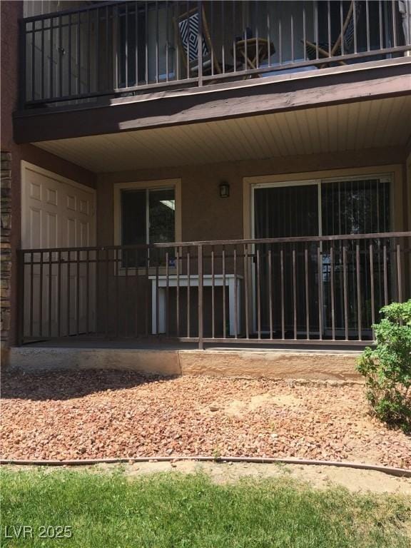 5000 Indian River Dr Unit 483, Las Vegas, NV 89103 - doorway to property with a balcony and stucco siding