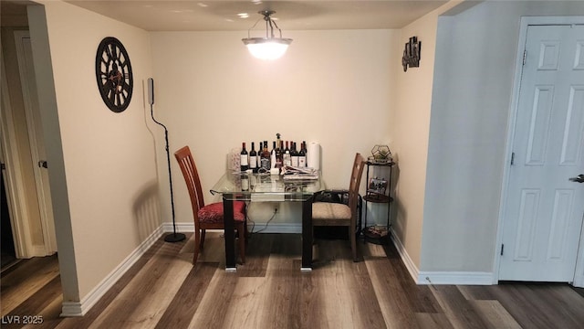 5000 Indian River Dr Unit 483, Las Vegas, NV 89103 - dining area featuring dark wood-style floors and baseboards
