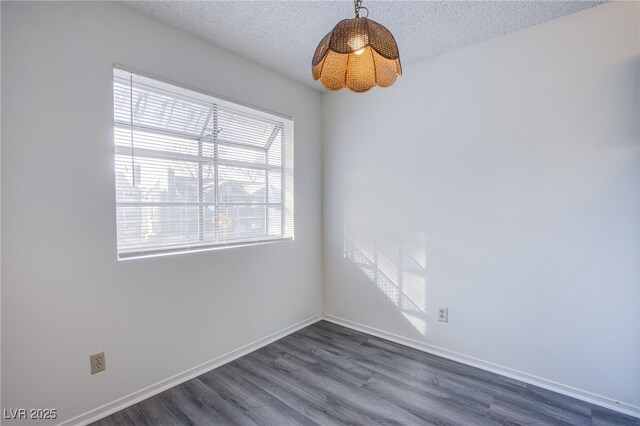 2696 Jennydiane Dr, Las Vegas, NV 89121 - spare room featuring dark wood-style floors and a textured ceiling