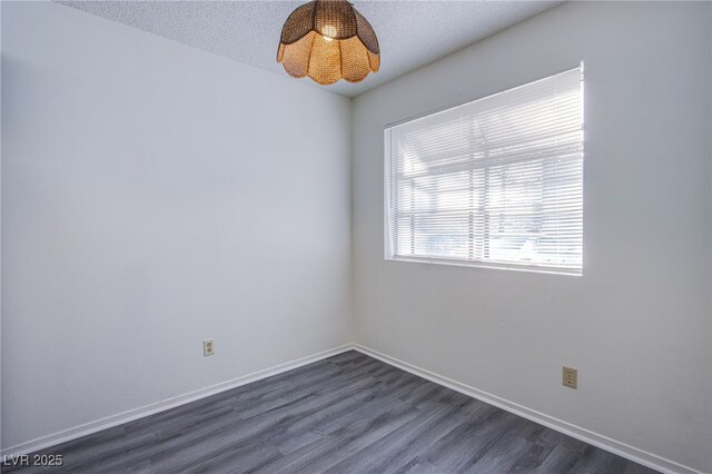 2696 Jennydiane Dr, Las Vegas, NV 89121 - spare room featuring dark wood finished floors and a textured ceiling