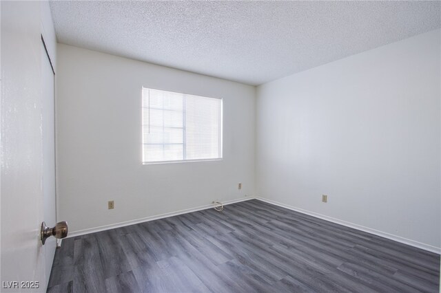 2696 Jennydiane Dr, Las Vegas, NV 89121 - empty room featuring dark wood finished floors and a textured ceiling