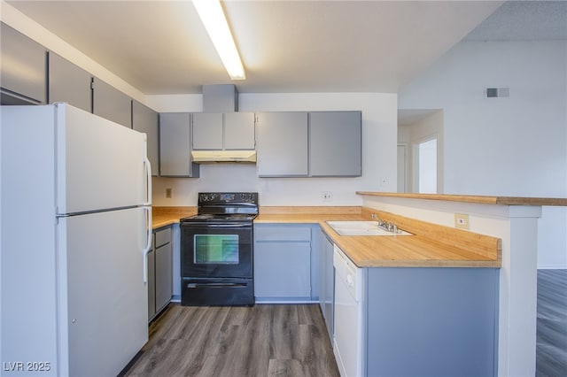 2696 Jennydiane Dr, Las Vegas, NV 89121 - kitchen with white appliances, gray cabinets, under cabinet range hood, and light countertops