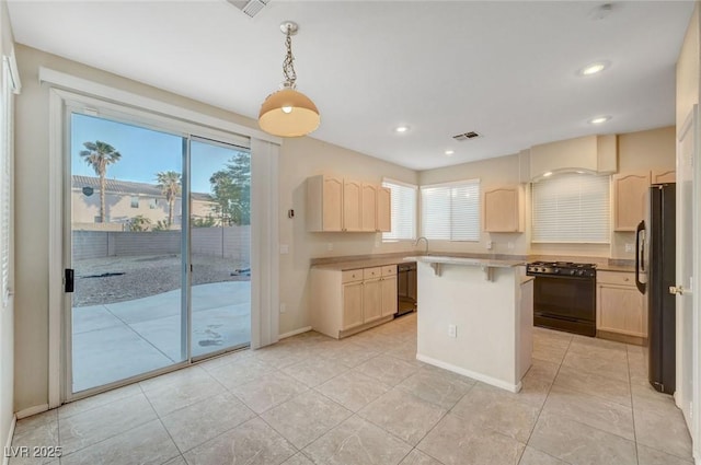 189 Paxon Hollow Ct, Las Vegas, NV 89148 - kitchen featuring black appliances, light countertops, light tile patterned flooring, a breakfast bar, and recessed lighting