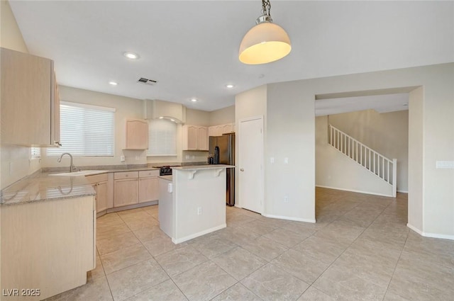 189 Paxon Hollow Ct, Las Vegas, NV 89148 - kitchen featuring light brown cabinetry, freestanding refrigerator, light countertops, a breakfast bar, and recessed lighting