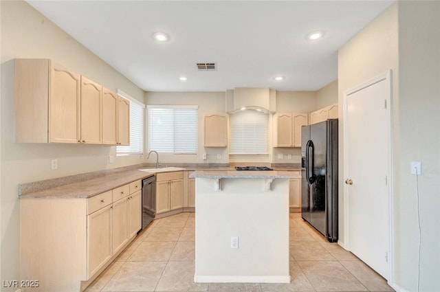 189 Paxon Hollow Ct, Las Vegas, NV 89148 - kitchen featuring black appliances, a breakfast bar area, light countertops, light tile patterned flooring, and recessed lighting
