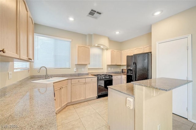 189 Paxon Hollow Ct, Las Vegas, NV 89148 - kitchen featuring black appliances, a center island, light tile patterned flooring, light stone counters, and light brown cabinets
