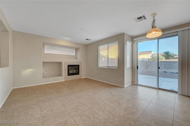189 Paxon Hollow Ct, Las Vegas, NV 89148 - unfurnished living room with a tiled fireplace and light tile patterned floors