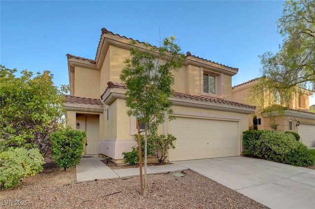 189 Paxon Hollow Ct, Las Vegas, NV 89148 - mediterranean / spanish-style home with a tile roof, driveway, an attached garage, and stucco siding