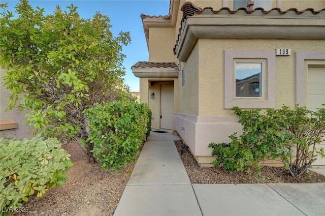 189 Paxon Hollow Ct, Las Vegas, NV 89148 - doorway to property featuring a tile roof and stucco siding