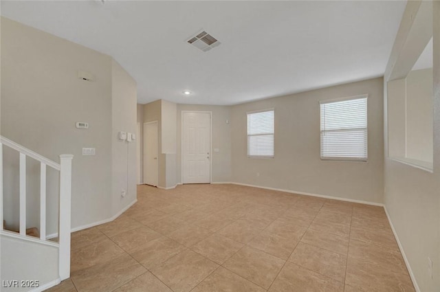 189 Paxon Hollow Ct, Las Vegas, NV 89148 - spare room featuring light tile patterned floors and stairs