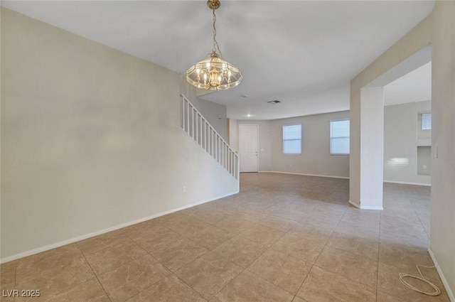 189 Paxon Hollow Ct, Las Vegas, NV 89148 - unfurnished room featuring a chandelier and stairway