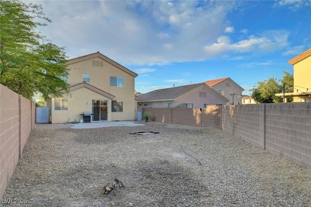 189 Paxon Hollow Ct, Las Vegas, NV 89148 - rear view of property with a fenced backyard, stucco siding, and a patio area