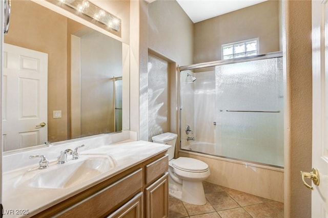1904 Hot Oak Ridge St, Las Vegas, NV 89134 - bathroom with vanity, bath / shower combo with glass door, and tile patterned flooring
