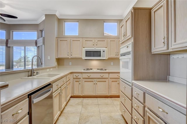 1904 Hot Oak Ridge St, Las Vegas, NV 89134 - kitchen with white appliances, a ceiling fan, light brown cabinets, light countertops, and ornamental molding