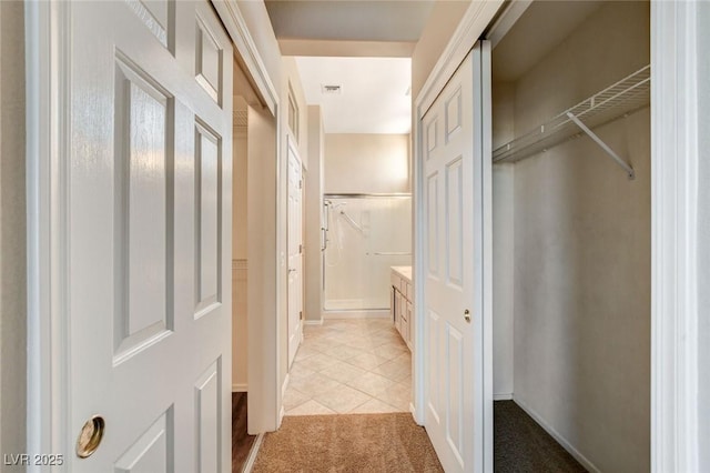 1904 Hot Oak Ridge St, Las Vegas, NV 89134 - corridor with light carpet and light tile patterned flooring