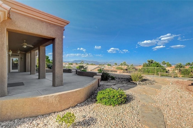 1904 Hot Oak Ridge St, Las Vegas, NV 89134 - view of yard featuring a patio, a ceiling fan, and a mountain view