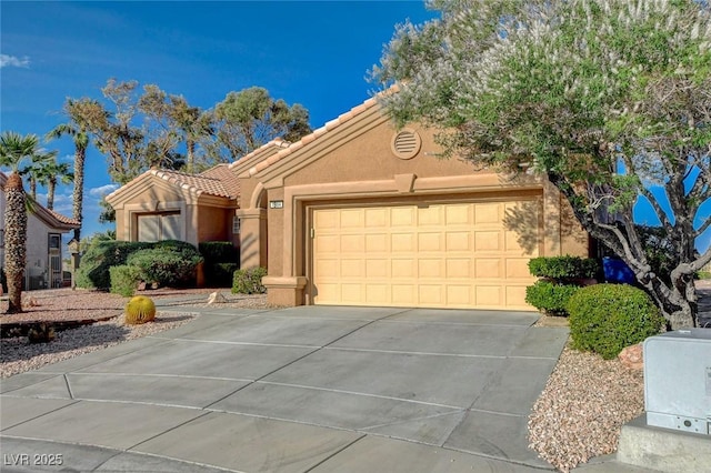 1904 Hot Oak Ridge St, Las Vegas, NV 89134 - view of front facade with concrete driveway, a tile roof, stucco siding, and a garage