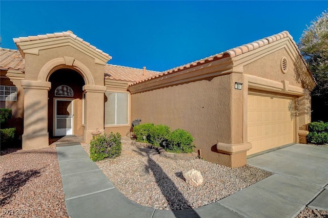 1904 Hot Oak Ridge St, Las Vegas, NV 89134 - mediterranean / spanish-style house with a tile roof, a garage, and stucco siding