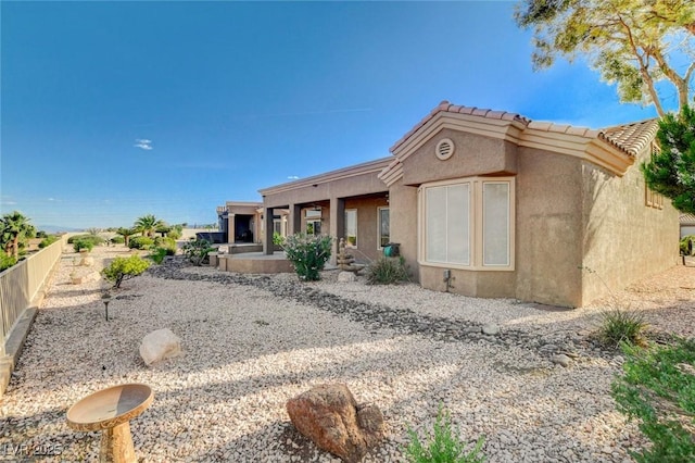 1904 Hot Oak Ridge St, Las Vegas, NV 89134 - back of house featuring stucco siding and a tiled roof