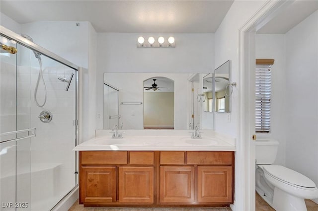 4841 Raw Umber Ct, Las Vegas, NV 89131 - bathroom with ceiling fan, double vanity, and a shower stall