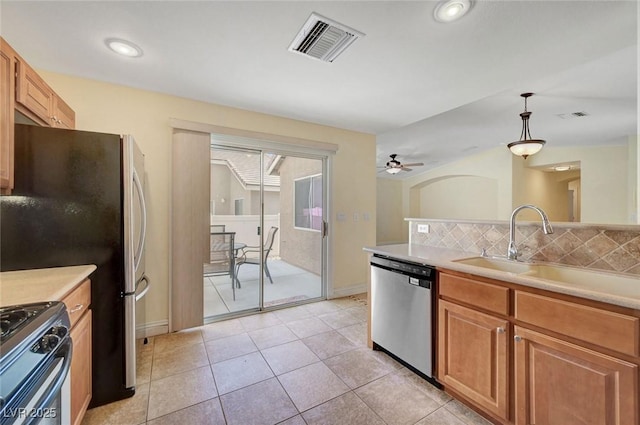 4841 Raw Umber Ct, Las Vegas, NV 89131 - kitchen with appliances with stainless steel finishes, ceiling fan, light countertops, and recessed lighting