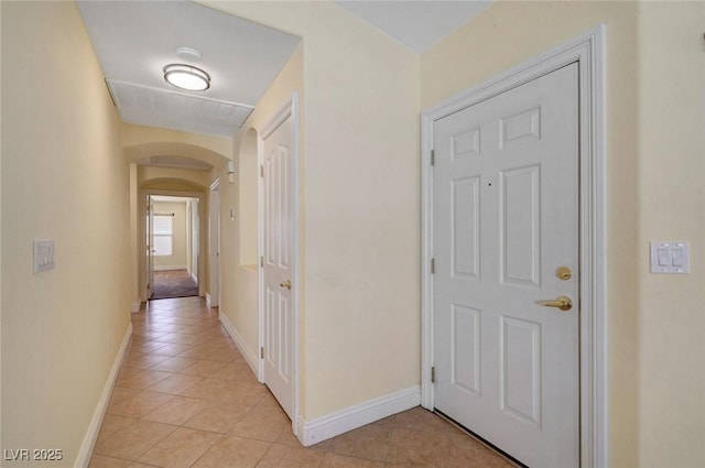 4841 Raw Umber Ct, Las Vegas, NV 89131 - hallway with light tile patterned flooring and arched walkways
