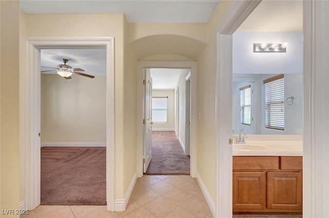 4841 Raw Umber Ct, Las Vegas, NV 89131 - hallway with light colored carpet and light tile patterned flooring