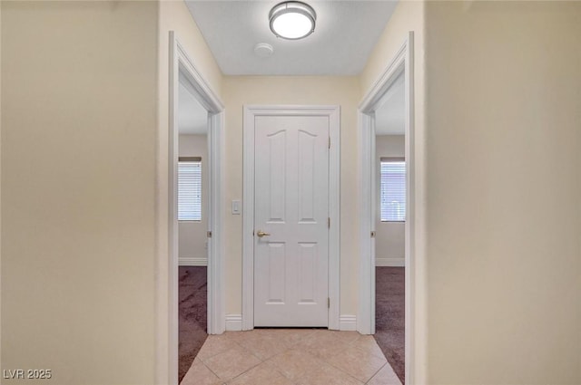 4841 Raw Umber Ct, Las Vegas, NV 89131 - hall with light carpet, light tile patterned flooring, and healthy amount of natural light