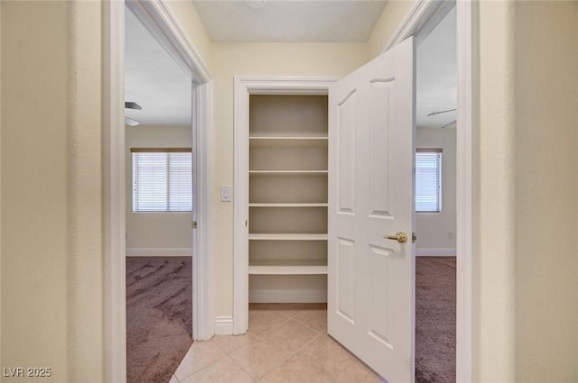 4841 Raw Umber Ct, Las Vegas, NV 89131 - corridor featuring light carpet and light tile patterned flooring