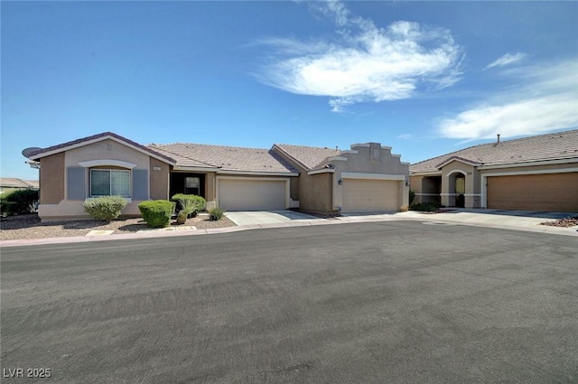 4841 Raw Umber Ct, Las Vegas, NV 89131 - ranch-style house featuring an attached garage, stucco siding, concrete driveway, and a tiled roof
