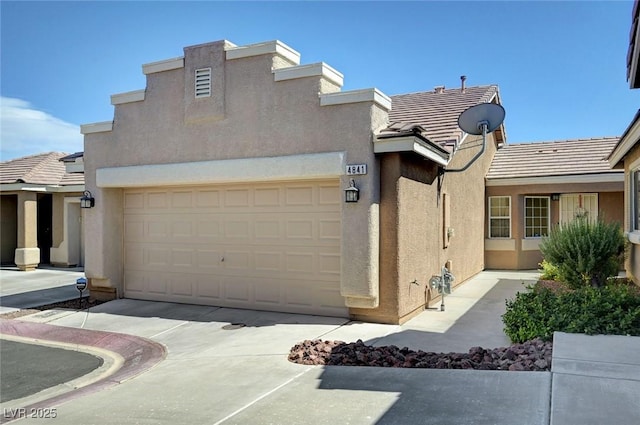 4841 Raw Umber Ct, Las Vegas, NV 89131 - view of front facade featuring stucco siding, concrete driveway, and a tile roof