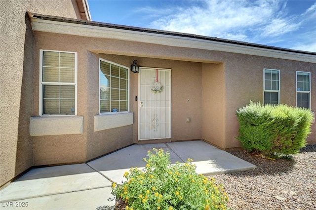 4841 Raw Umber Ct, Las Vegas, NV 89131 - entrance to property featuring stucco siding and a patio area
