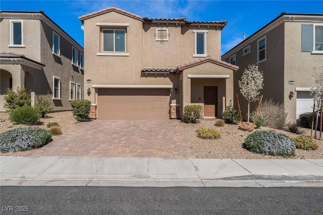 9850 Poplar Point Ave, Las Vegas, NV 89178 - view of front of house with a tile roof, stucco siding, a garage, and decorative driveway
