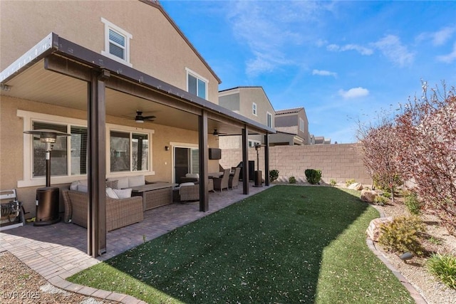 9850 Poplar Point Ave, Las Vegas, NV 89178 - view of yard featuring ceiling fan, an outdoor living space, and a patio