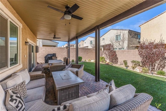 9850 Poplar Point Ave, Las Vegas, NV 89178 - fenced backyard featuring an outdoor hangout area, a ceiling fan, a patio, and area for grilling