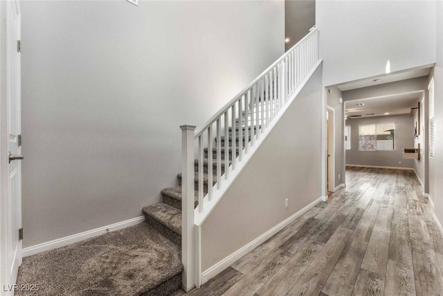9850 Poplar Point Ave, Las Vegas, NV 89178 - stairway with wood finished floors and a towering ceiling